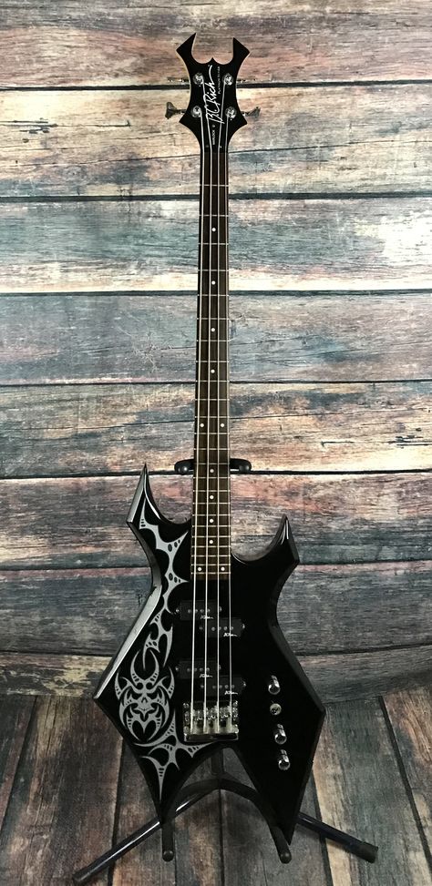 Goth Bass Guitar, Cool Electric Basses, Bc Rich Guitars Warlock, Warlock Bass Guitar, Bass Guitar Pictures, Bass Electric Guitar, Cool Instrument Design, Warlock Electric Guitar, Bc Rich Warlock Guitar