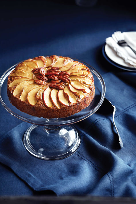 Apple-pecan olive-oil cake topped with sliced apples and pecans on a cake stand. Beet Brownies, Applesauce Cake Recipe, Savory Apple Recipes, Olive Oil Cake Recipe, Dairy Free Cake, Applesauce Cake, Oil Cake, Olive Oil Cake, Warm Cake