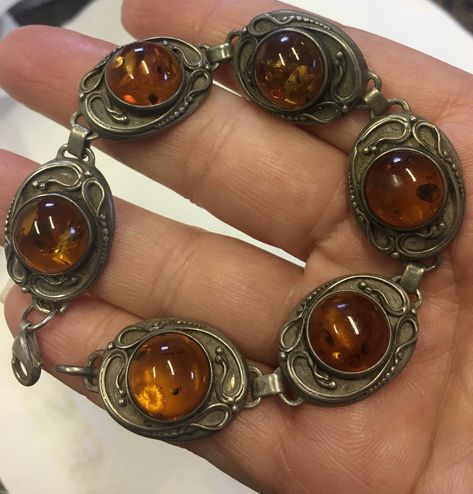 Vintage Silver Amber bracelet, Amber Bracelet, Amber Jewellery, divine piece A delightful silver Vintage Amber bracelet, a fantastic piece with beautiful colour Amber stones. Lovely quality with divine ornate detail. A very rare piece. Perfect for a present for a loved one. Vintage Amber Jewelry, Three Necklaces, Amber Bracelet, Ancient Jewelry, Amber Stone, Bracelet Vintage, Amber Jewelry, Chain Link Bracelet, Cute Jewelry