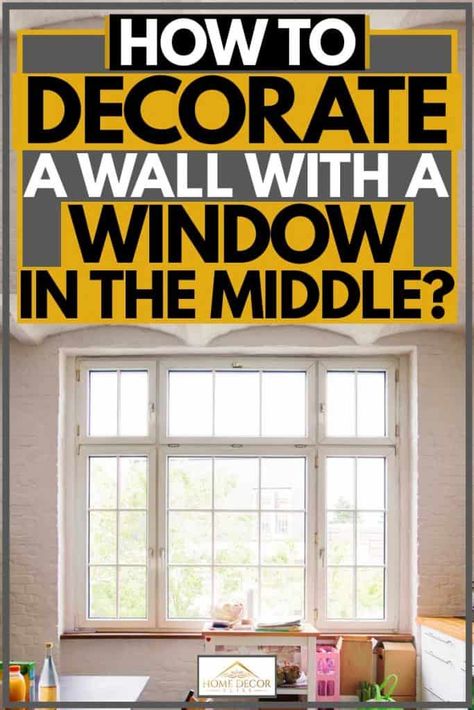 How To Decorate A Wall With A Window In The Middle? Article by HomeDecorBliss.com #HomeDecorBliss #HDB #home #decor Accent Wall Window Living Room, How To Decorate A Wall With A Window, Wall With Window In The Middle, Small Dining Room Ideas With Window, Small Living Room Window Ideas, Above Kitchen Window Decor, Accent Wall Around Window, Large Window Decor, Above Window Decor