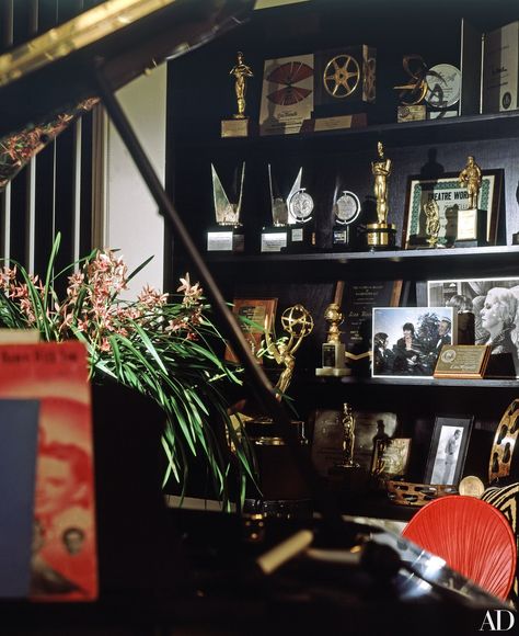 Among Liza Minnelli's awards filling the music room bookcases are an Academy Award for Best Actress in Cabaret, 1972; Tony Awards for Best Actress in The Act and Flora, the Red Menace; an Emmy for the television special Liza with a Z; and various international film honors. Award Shelves, Cabaret 1972, Manhattan Apartment, Liza Minnelli, Academy Award, New York Apartment, Low Tables, Tony Awards, Celebrity Houses