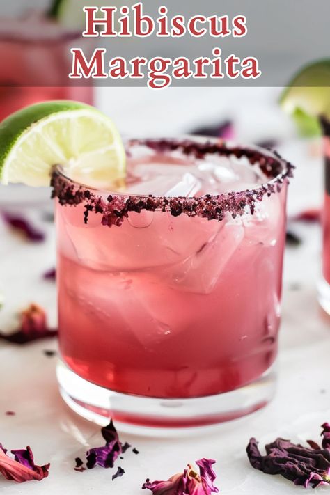 The Hibiscus Margarita is a vibrant and refreshing twist on the classic margarita, blending the bold flavors of tequila, triple sec, and lime juice with the floral and slightly tart notes of hibiscus syrup. Hibiscus Margarita Recipe, Hibiscus Margarita, Hibiscus Syrup, Tequila Drinks, Classic Margarita, Margarita Recipe, Tequila Cocktails, Alcoholic Beverages, Punch Recipes