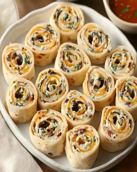 Learn to prepare savory cream cheese and olive pinwheels—simple, tasty, and perfect for parties. Get the easy recipe and tips here! Pinwheels With Olives, Olive Pinwheels, Appiterzers Easy Recipes, Pinwheel Appetizers Cream Cheese, Baked Olives, Olive Appetizer, Cream Cheese Pinwheels, Tortilla Pinwheels, Cheese Pinwheels