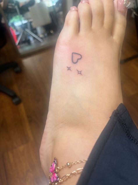 Heart Feet Tattoos, Small Hearts And Stars Tattoo, Tattoo Ideas On The Ankle, Red Ink Finger Tattoos For Women, Easy Ankle Tattoo, Different Color Tattoos, Hand Sparkles Tattoo, 200s Tattoos, Heart Y2k Tattoo