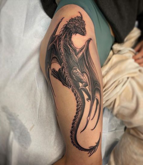 Dragon 🐲🐲by @dalehgm Dale's books are Open! Call to book 7804885070 . . . . . . . #dragon #dragontattoo #theblackandgreytattooleague #blackandgreytattooartist #blackandgreytattoos #blackandgreytattoo #crimsonempiretattoo #crimsonempire #yeg #yegtattoo #yegtattoos #yegtattooshop #yegtattooartist #yeglocal #yegsmallbusiness #yeggers #shoplocalyeg #yegbusiness #yeglife #blackgoldtattooco #BGTC Dragon Crawling Tattoo, Dragon Bicep Tattoos For Women, Upper Arm Dragon Tattoos For Women, Protective Dragon Tattoo, Patchwork Dragon Tattoo, Dragon Tattoo Cover Up, Dragon Leg Sleeve Tattoo, Dragon Tattoo Bicep, Dragon Wrapped Around Leg Tattoo