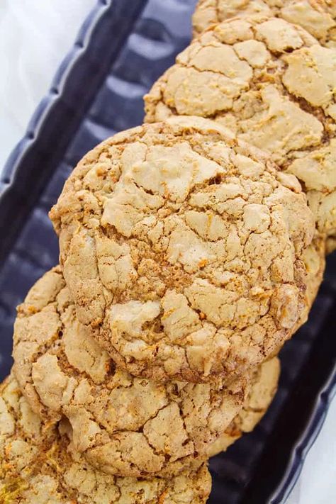 These carrot cake cookies are packed full of flavor. They have a pretty crinkled top and a chewy texture. They could easily become carrot cake sandwich cookies if you wanted to fill them with a cream cheese frosting. Cookies With Cream Cheese Chips, Cream Cheese Chips, Carrot Cake Sandwich Cookies, Carrot Cake Cookies Recipe, Mini Lemon Cheesecakes, Sandwich Cookies Filling, Cake Bars Recipe, Cookies Dough, Cookies With Cream Cheese