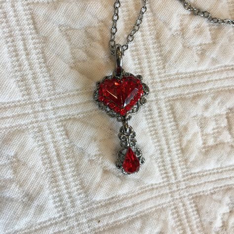 "Victorian Reproduction Red Heart Necklace. Cut Heart Stone With Ring of Red Rhinestones Around Plus Teardrop Dangle in Swirling Setting. Nickel Free and Lead Free. Great for costuming wear. This necklace is in good shape. Size: Pendent; 5/8\" X 1 1/4\" For other animal jewelry and vintage items see: www.VeryVictorianStudio.etsy.com For sewing related items see my other shop: www.SewingRoomStore.etsy.com Thank you for looking!" Vintage Heart Pendant, Faire Outfit, Lace Placemats, Red Heart Necklace, Paper Feathers, Silk Bag, Heart Stone, Jewellery Inspiration, Dope Jewelry