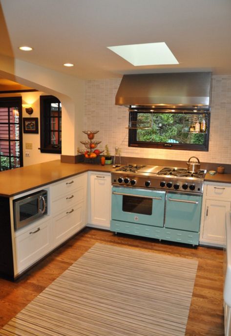 Love the window and range hood above Bluestar stove and hidden microwave in lower cabinet. Stove With Window Above, Window Behind Range, Stove In Front Of Window Kitchen, Window Behind Stove, Cottage Eclectic, Cottage Addition, Bluestar Range, Stove Design, Stucco House