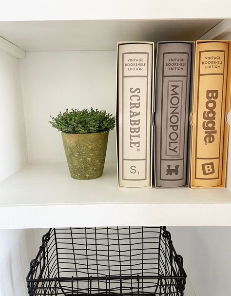 Add vintage classic board games to your shelves for fun and functionality. These linen vintage bookshelf editions of scrabble, monopoly and boggle look pretty displayed on a shelf and make it easy to grab and play on a rainy day. Vintage Bookshelf Edition Games, Vintage Bookshelf Board Games, Vintage Bookshelf Games, Vintage Board Games Decor, Board Games Display, Bookshelf Board Games, Vintage Board Games Aesthetic, Aesthetic Board Games, Book Display Ideas Home