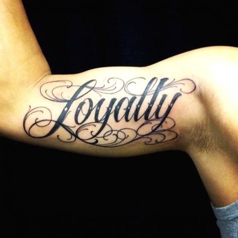 Loyalty Tattoo Ideas Gallery #mentattoos #tattoosformen Tattoos Meaning Strength, Inside Bicep Tattoo, Loyalty Tattoo, Unique Half Sleeve Tattoos, Inner Bicep Tattoo, Names Tattoos For Men, Tattoos Meaning, Omerta Tattoo, Bicep Tattoo