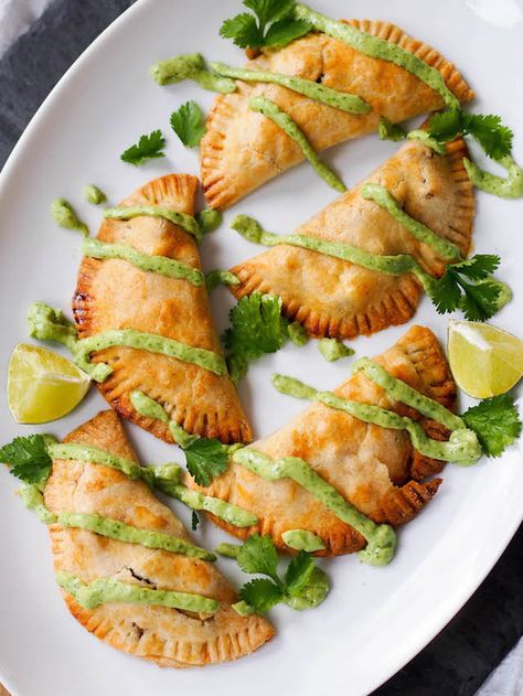 Wrapped in a whole wheat crust, potato empanadas with corn and goat cheese are a delicious Peruvian-inspired bite. Serve with avocado chimichurri. Avocado Chimichurri, Vegan Empanadas, Cheese Empanadas, Latin Recipes, Peruvian Recipes, Think Food, Vegan Eating, Goat Cheese, Mexican Food Recipes