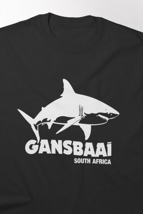 Unisex T-Shirt | Often referred to as the "Great White Shark Capital of the World," Gansbaai offers cage diving experiences that allow you to get up close with great whites. It's located near Cape Town and is one of the most popular spots globally. #redbubble #findyourthing #gansbaai #shark #scubadiving #tshirts #sharktshirts #gansbaaishirts Shark Diving, Shark Lover, Shark T Shirt, The Great White, White Sharks, Great White Shark, Great White, Sharks, Scuba Diving