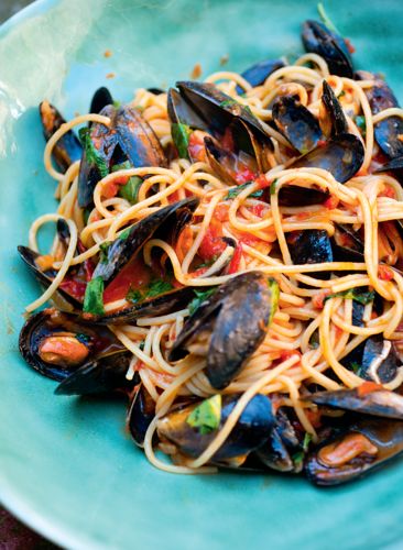 Spaghetti with mussels and tomato sauce is a classic summer dish and something you see in every restaurant on Italy's Amalfi coast. Angela Hartnett's recipe from A Taste of Home is quick and easy – and one delicious mouthful will immediately transport you to the finest Italian restaurant. Buon appetito! Mussels Spaghetti Recipe, Mussles Recipe Pasta, Spaghetti With Mussels, Spaghetti And Mussels, Mussel Spaghetti, Mussels Recipe Pasta, Seafood Marinara, Mussels Marinara, Mussels Pasta