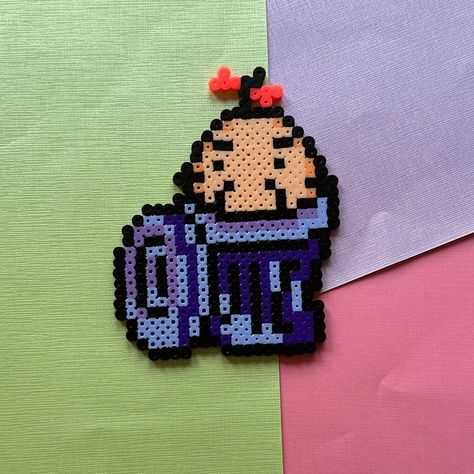 Introducing handmade perler bead art featuring a Mr. Saturn hiding in a trash can! This little shy friend is from the acclaimed JRPG Earthbound! This would be a perfect gift for fans of retro gaming or anyone who appreciates this strange little guy! * Perler is 5.5 inches x 4 inches * Both sides ironed, semi-melted to provide a more 'pixel' effect - however, the perler itself is very sturdy. * Recommended for indoor use for decoration purposes only. * Made to order - 3-5 business days for handling. *  For a limited time only, add a free magnet, pin, OR keychain with your purchase! Magnet will be glued to the back of the perler. Larger perlers may require two magnets, but will be placed for optimum wall hold. 【ＳＨＩＰＰＩＮＧ FAQ】 Perlers are shipped USPS Priority, with tracking. They are shipped Mr Saturn, Game Decor, Video Game Sprites, Art Perle, Retro Game, Gaming Decor, Perler Bead Art, Perler Bead, Perler Beads