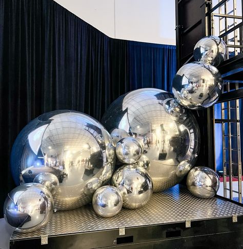 Honored to create this futuristic setup for @siemens_usa #PFE24 awards ceremony! ✨ 🚀 Our silver Spheres, lighted Marquee Letters, custom Star Arch, and a fully customized backdrop brought the perfect touch to such an important event. For us there’s nothing better than creating moments that help celebrate hard work and success.💫 #siemensenergy #technology #balloon #balloonstylist #balloondecorator #balloonartist #balloonstylists #orlandoballoons #orlandoballoons #spheres #stepandrepeat #cu... Silver Backdrop With Balloons, Futuristic Party Decor, Futuristic Event Decor, Award Ceremony Decorations, Silver Party Theme, Futuristic Event, Customized Backdrop, Futuristic Party, Lighted Marquee Letters