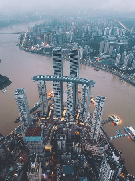 Moshe Safdie, Singapore Guide, Chongqing China, Overseas Jobs, Sky Bridge, Indoor Waterfall, Tall Buildings, Skyscraper Architecture, Tower Building