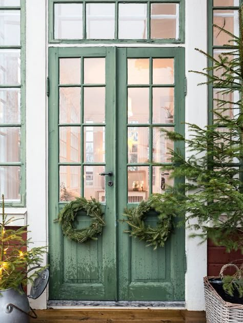 A Swedish country home at Christmas Painted French Doors, Green Doors, Swedish Farmhouse, Vibeke Design, Swedish House, Christmas Porch Decor, Green Door, Design Seeds, Doors And Windows