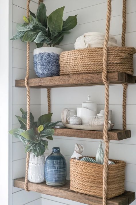 "Transform your space with stylish DIY Rope Shelving! 🛠️🌊 Ideal for creating a breezy, coastal vibe in any room. 🌿✨ #DIYShelving #CoastalInspiration #RopeDecor" Beach House Shelves, Beachy Shelves, Beachy Shelf, Coastal Shelves, Shelves With Rope, Coastal Shelf Decor, Showcase Ideas, Beachy Crafts, Hanging Wood Shelves