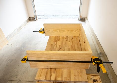 Table laying on its side with trigger clamps pressing joints together. Diy Waterfall Table Console Tables, Diy West Elm Console Table, Diy Waterfall Entry Table, Waterfall Ottoman Table Diy, Waterfall Side Table, Build A Console Table Diy, Entryway Table Diy Plans, How To Build A Console Table, Waterfall Console Table Diy