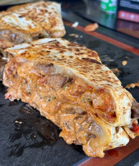 Steak and Shrimp Quesadilla - Tony Chachere's Blackstone Steak, Quesadilla Fillings, Shrimp Quesadilla, Shrimp N Grits Recipe, Cajun Sauce, Sauteed Peppers, Steak And Shrimp, Grits Recipe, Juicy Shrimp