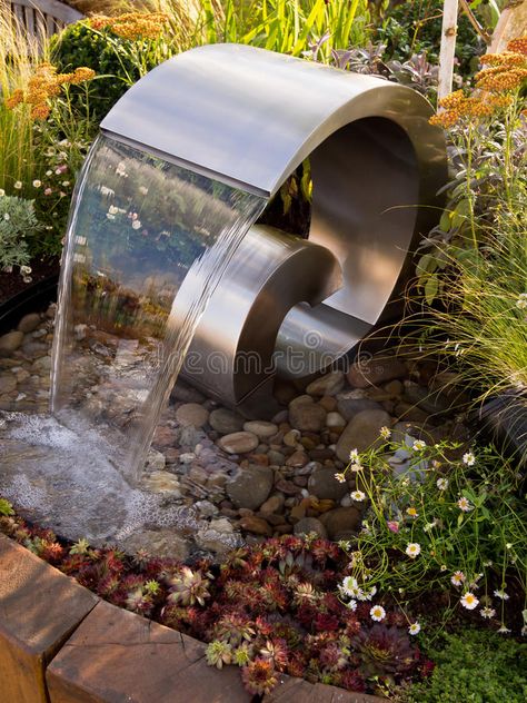 Sensory Garden Water Fountain Sculpture. Close up of a water fountain sculpture set amongst herbs and flowers in a sensory garden stock photography Water Sculpture Fountain, Modern Fountains Outdoor, Sensory Garden Design, Garden Fountain Ideas, Fountain Sculpture, Yard Fountain, Water Fountain Design, Fountain Ideas, Sculpture Fountain