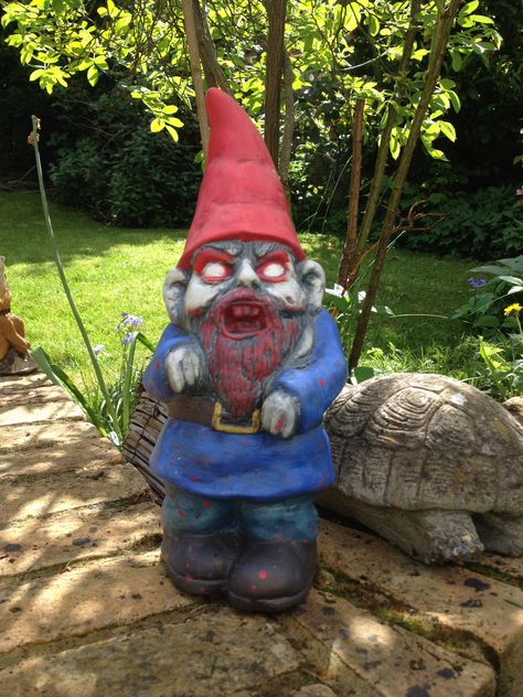 Garden gnomes freak me out on a normal day, but this one is super creepy! Zombie Garden, Lawn Gnome, Garden Gnomes, Garden Gnome, Gnome Garden, Zombie Apocalypse, On The Ground, Hallows Eve, Resident Evil