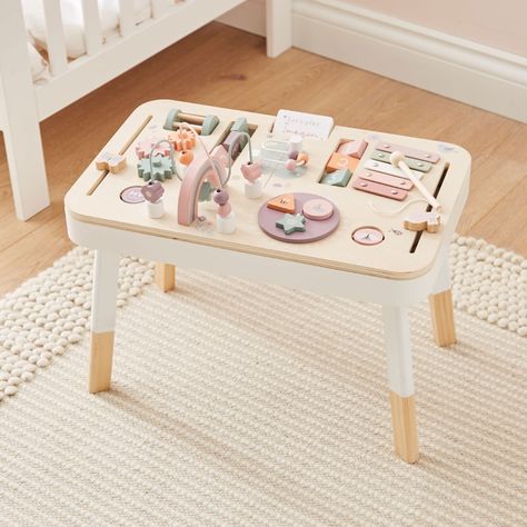 We pink this personalised pink activity table will get your little one excited for playtime every day. This sturdy table is crafted from wood and painted in calming shades of cream and pastel pink, purple and orange, with four detachable legs and a rectangular table top. The surface is packed with countless features designed to engage curious minds, enrich their senses and develop their motor skills. This wonderful activity table features a functioning xylophone, shape sorter, turning cogs, anim Play Table For Kids, Activity Table For Kids, Toddler Activity Table, Wooden Children's Toys, Montessori Table, Children Table, Kids Play Table, Baby Playroom, Baby Room Inspiration