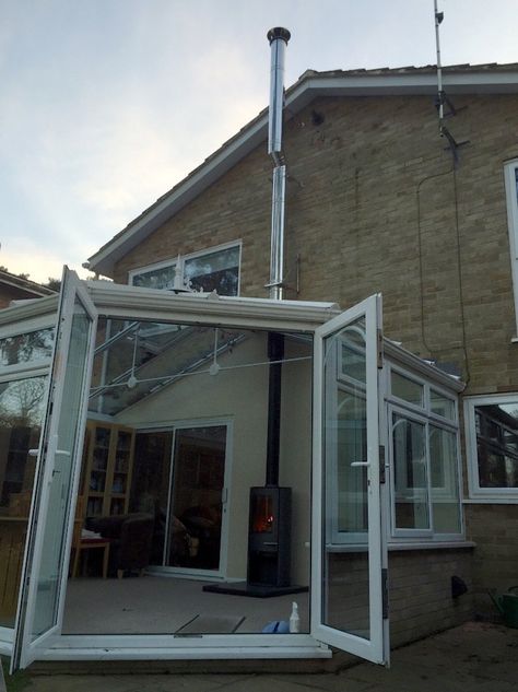 Image showing an external flue into a conservatory External Fireplace, Yard Layout, Conservatory Interiors, Corner Wood Stove, Woodburning Stove Fireplace, Wood Burner Fireplace, Conservatory Extension, Conservatory Decor, Chimney Design