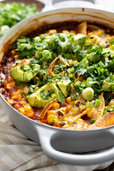 This Black Bean Tortilla Enchilada Rice Bake is a one-pot vegan dinner that is packed with veggies, rice, beans, corn salad and crispy tortillas | ThisSavoryVegan.com #thissavoryvegan #dumpandbake #vegancasserole 1 Pot Vegan Meals, Black Beans Dinner Recipes, Black Bean Tortilla Casserole, Cozy Vegetarian Dinner, Rice And Bean Meals, Enchilada Vegetarian, Mexican Bean Rice, One Pot Vegetarian Meals, Beans And Rice Recipes