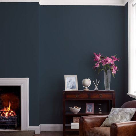 This is a truly stunning dark blue that creates a dramatic backdrop. Laura Ashley paints are high quality water based paints created using the richest pigments for depth of colour and even results. Our paint collection beautifully complements our wallpaper ranges. Laura Ashley Paint, Blue Feature Wall, Navy Living Rooms, Wall Colours, Feature Wall Living Room, Room Color Schemes, Blue Living Room, Painted Ceiling, Living Room Colors