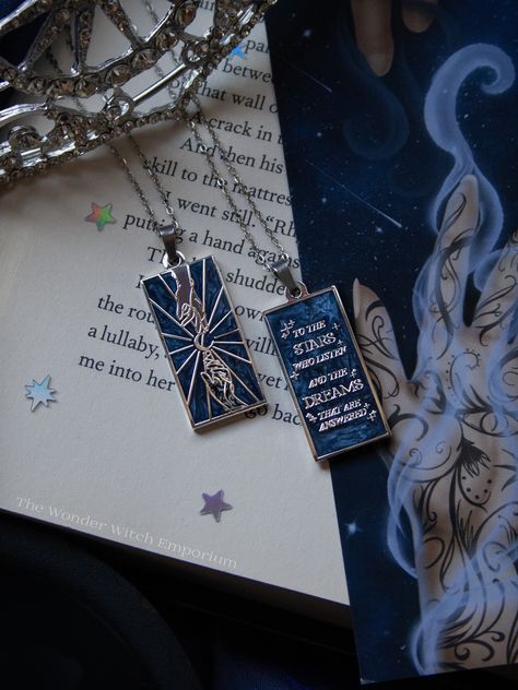 "☽ \"To the stars who listen, and the dreams that are answered\" ☾ The Star Crossed Lovers Necklace is inspired by our favorite bookish couple, Feyre & Rhysand, the essence of their mating bond and everything it represents 🌌🏔️✨ This piece serves as a reminder of meant-to-be's, overcoming difficult times and love conquering all ♡ May each of us find our own Court of dreams... but in the meantime, this necklace represents a portion of mine, and I hope it can be yours too ✨🌙 Illustrated and designed by yours truly 🤍 DETAILS Each pendant charm is Sterling Silver plated, with a double-sided blue swirl fill, approximately 1.3x3 inches in size. The necklace is 18 inches in length and the chain and findings are both Sterling Silver plated with a stainless steel fill. The necklace chain and pen Acotar Jewelry, Starbucks Hot Chocolate, Feyre Rhysand, Feyre And Rhysand, Princess Gifts, Book Necklace, Star Crossed Lovers, Candle Making Kit, Lovers Necklace