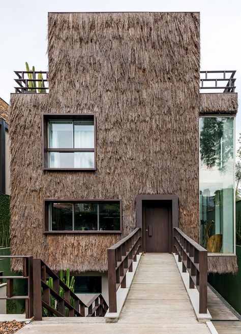 Campanas Brothers use palm fibre to give Sao Paulo house hairy texture Thatched Roof, Natural Building, Top Interior Designers, Facade Architecture, Stone House, Facade Design, Built Environment, Facades, Residential Architecture