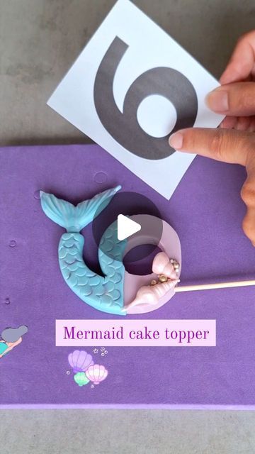 Love4sweetsandcake on Instagram: "✨️How to make a mermaid cake topper number 6 ✨️  This video shows step by step how to make a mermaid themed cake topper 🧜‍♀️  I made this video because i got often questions about where to put a cocktaiI stick in the number (without tearing or cracking the fondant up) and also if i could make a mermaid topper 🐚🪸.   So today i made this tutorial specially for the ones who asked me to show a mermaid themed number and how to put a cocktaiI stick in the topper. Hope you like it 🩷.  🎂 Tip: Make rotational movement (don't push) when putting the stick into the topper. Make sure the stick stays straight, don't go down or up or the stick will come out of the fondant. In the video you can see how i put a toothpick into the mermaid tail, this is also how you put Mermaid Theme Decoration, Fondant Numbers Topper, Mermaid Topper, Mermaid Themed Cake, Fondant Numbers, Mermaid Tail Cake, Cake Topper Number, Mermaid Cake Topper, Number Cake Toppers