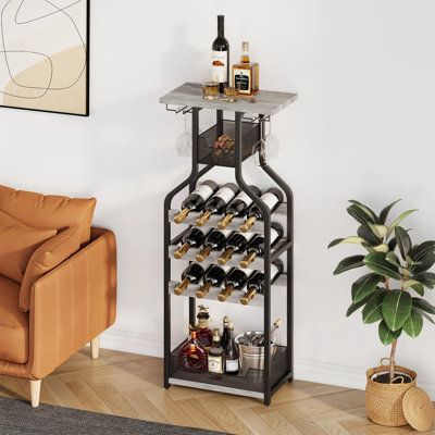 This wine rack is designed with the design elements of wine bottles, with unique shapes and ornamental. The tabletop Makes for a perfect surface to pour out drinks and hold an open bottle. The metal basket is perfect for corks and wine openers. The wine glass rack can hold 4 wine glasses to meet the needs of the family. The wine rack can hold 12 bottles of wine. The shelves can hold ice buckets, special-shaped wine bottles, and other items | 17 Stories Corrianne Wine Bottle & Glass Rack gray | C Open Bottle, Metal Bar Cart, Kitchen Dining Living Room, Metal Wine Rack, Wine Bottle Rack, Wine Glass Rack, Ice Buckets, Kitchen Dining Living, Glass Rack