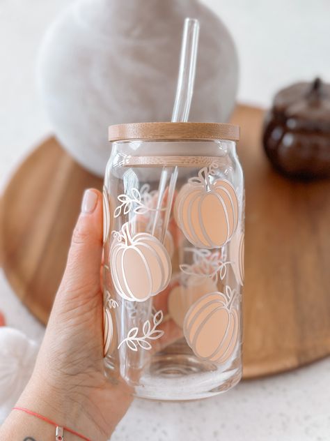 Boho Pumpkin Glass Cup 16oz glass beer can comes with a bamboo lid and straw. The bamboo lid includes a sleek proof silicone sleeve which seals your drink in the glasses and prevents leaks. Washing Instructions: Gently hand wash only with a non-abrasive sponge to prevent scratching. Not dishwasher safe. Not microwave safe. Do not soak/submerge. Clean with mild soap & water. Dry bamboo lids right away. Clean straw with a brush. Glass Cups With Vinyl Cute Ideas Fall, Pumpkin Glass Cup, Tumbler Pictures Ideas, Boho Glass Cups, Can Cup Design, Aesthetic Glass Cups, Glass Coffee Cup Design, Glass Tumbler Design Ideas, Cricut Cup Ideas