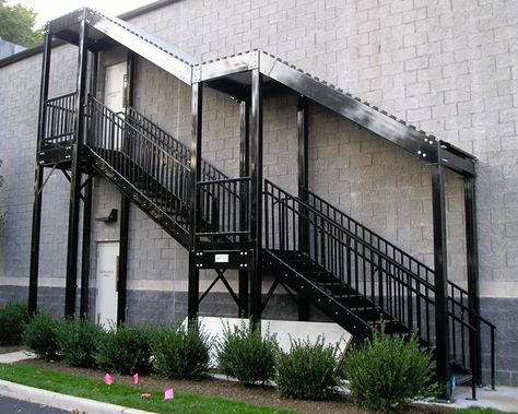 Cubic Designs builds custom industrial stairs for indoor and outdoor applications. Custom or prefabricated stairs are available now for your facility. Stair Roof Design, Roof Stairs Outdoor, Metalic Stairs Outdoor, Outdoor Stairs With Roof, Exterior Staircase Design Outdoor, Covered Exterior Stairs, Covered Outdoor Stairs, External Staircase Outdoor Stairs, Outdoor Staircase Design Entrance