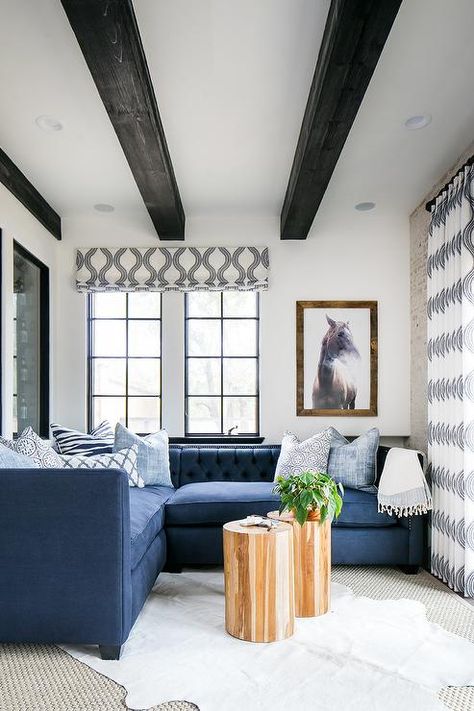 Wonderfully decorated blue and white living room is furnished with a blue tufted low back sectional accented with white and blue pillows. Black Beams, Ceiling Beams Living Room, Beams Living Room, Blue And White Living Room, Transitional Living Rooms, White Living, White Ceiling, White Living Room, Pictures Ideas