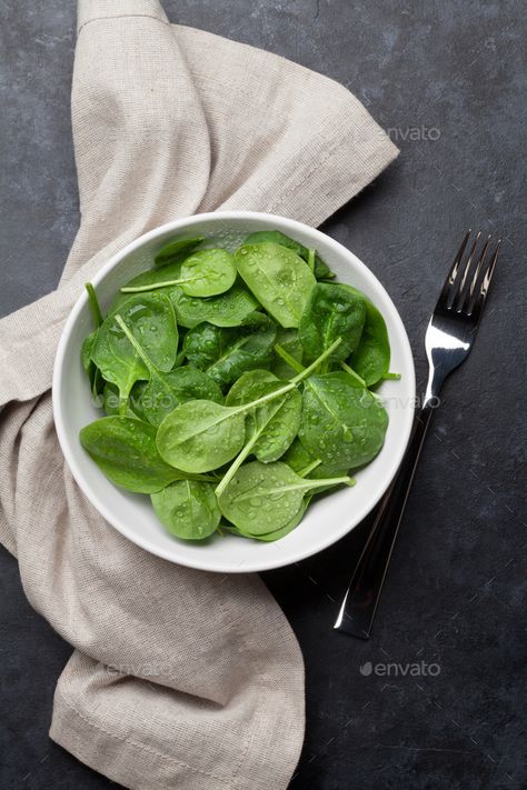 Spinach salad by karandaev. Fresh garden spinach salad bowl on stone table. Top view #Affiliate #Fresh, #garden, #karandaev, #Spinach Table Top View, Stone Table, Spinach Salad, Salad Bowl, Salad Bowls, Top View, Spinach, Table Top, Salad