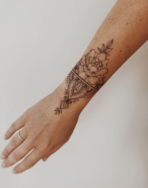 Floral Mandala Wrist Tattoo, Women’s Wrist Wrap Tattoo, Forearm Bracelet Tattoo Women, Heart Ornamental Tattoo, Wrist Adornment Tattoo, Women Wrist Tattoos Ideas, Outside Wrist Tattoos For Women, Lotus Flower Wrist Tattoo, Wrist Wrap Tattoos For Women