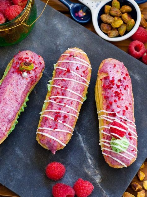 Eclair Recipe Videos, Raspberry Eclairs, Eclair Dessert, Choux Dough, Raspberry Pistachio, Eclair Recipe, Pistachio Cream, Dried Raspberries, Choux Pastry