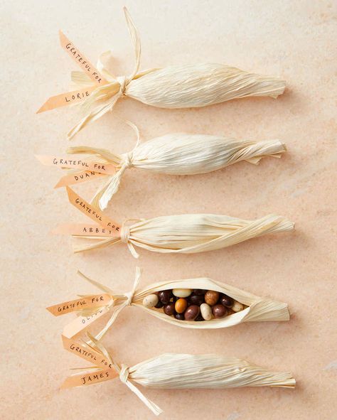 corn husks containing chocolate-covered espresso beans Thanksgiving Place Settings, Corn Husk Crafts, Chocolate Covered Espresso Beans, Corn Husks, Thanksgiving Favors, Convention Gifts, Candy Wedding Favors, Treat Holders, Hosting Holidays