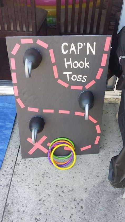 Pirate birthday party game! Re-pinned by PSST! Let's Talk- Follow for more ideas: https://www.pinterest.com/speechtherapytx/ Pirate Pool Party Ideas, Captain Hook Ring Toss Game, Diy Pirate Birthday Party, Captain Hook Ring Toss, Off Two Neverland Party, Pirate Ring Toss, Pirate Mickey Birthday Party, Peter Pan Theme Party, Peter Pan Party Games