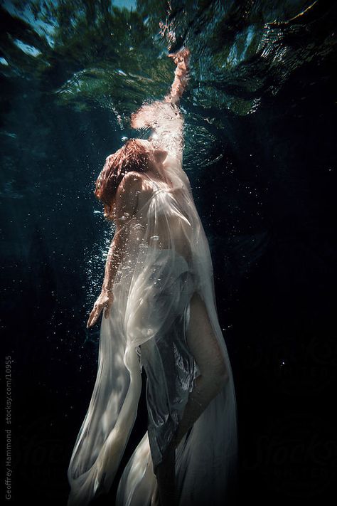 A woman swimming upward to the water surface. Dark Academia Aesthetic Fashion Women, Women In Water, Underwater Drawing, Mother Nature Tattoos, Underwater Portrait, Water Shoot, Underwater Painting, Ocean Kids, Water Aesthetic