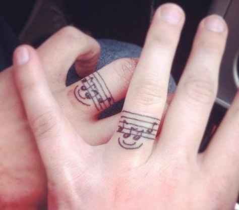 Music Couple Tattoos Small Music Tattoos, Music Lover Tattoo, Marriage Tattoos, Ring Tattoo Designs, Wedding Band Tattoo, Tattoo Band, Ring Tattoo, Tattoos Infinity, Tattoo Wedding Rings