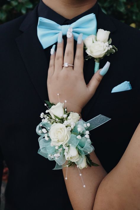 Light Blue And White Corsage And Boutonniere, Mint Green Corsage And Boutonniere, Prom Flowers For Iridescent Dress, Corsage And Boutonniere Ideas, White And Teal Corsage, Blue Corsage Homecoming, Corsage And Boutonniere Set Prom, Corsage For Teal Dress, Corsage Ideas Prom