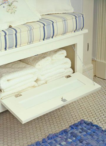 Window Seat Storage - A wall-mount window seat has a second purpose as towel storage. A flip-down door provides easy access. Small toiletries can also be stored beneath the seat. Or remove the cushion and use the seat top to display towels and other bath needs, with less attractive supplies hidden below. Bathroom Storage Bench Ideas, Sitting Bench With Storage Bathroom, Flip Down Door, Bathroom Storage Under Window, Bathroom Window Seat, Bathroom Window Bench, Storage Bench In Bathroom, Bathroom Bench With Storage, Bathroom Benches With Storage