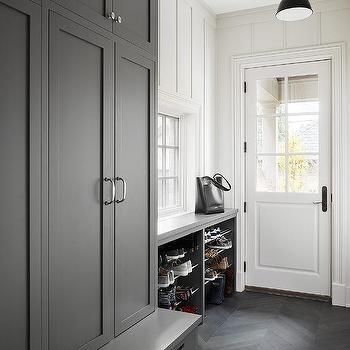 Charcoal Gray Mudroom Lockers with Dark Gray Chevron Pattern Floor Tiles - Transitional - Laundry Room Mudroom Countertop, Gray Mudroom, Entryway Cabinets, Kitchen Alcove, Tudor Renovation, Mudroom Floor, Chevron Pattern Floor, Contemporary Laundry, Tile Transition