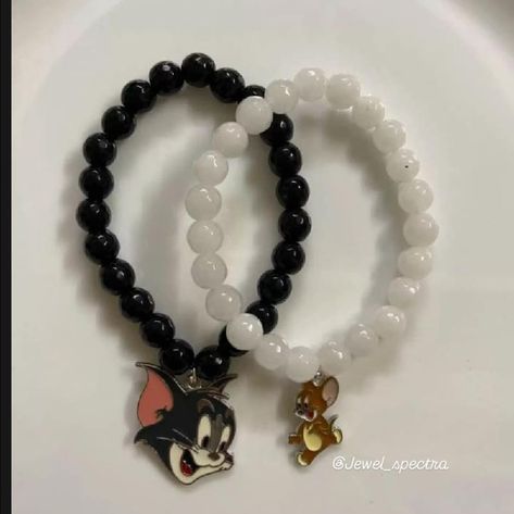 **Tom and Jerry Couple Bracelet** Celebrate your playful bond with these Tom and Jerry couple bracelets. Each bracelet features a charm—one with Tom and the other with Jerry—symbolizing the fun and unique connection you share. With adjustable straps for a perfect fit, these bracelets are a stylish and nostalgic way to express your love and a little friendly rivalry. #jewelspectra #handmade #asthetic #accessories #couplebracelet #tomandjerry #youth #trending #trendingnow #teenagefashion #feed... Tom And Jerry Couple, Friendly Rivalry, Couple Bracelet, Couple Bracelets, Tom And Jerry, Adjustable Straps, Perfect Fit, Charm Bracelet, Bracelet