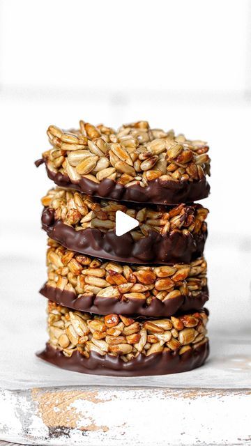 Nadia Al-Khaffaf on Instagram: "If you’re looking for an easy crunchy snack that’s also good for you, try these ✨4-ingredient Sunflower Seed Chocolate Bites✨ All you need is sunflower seeds, maple syrup, salt and dark chocolate - that’s it! 😍 A fun way to get more heart healthy seeds into your diet that also satisfies your sweet & crunchy cravings ♥️ Click the link in my bio to take you straight to the recipe & nutritional breakdown. Or head to nadiashealthykitchen.com 😘 Nadia xx #vegantreats #vegansnacks #healthysnacks #healthydessert #seeds #sunflowerseeds #crunchysnacks #4ingredients #easydessert #vegandessert #dairyfree #gutfriendly #darkchocolate #dairyfreesnacks #flutenfreesnacks #nutfree #easyrecipes #healthyfood #healthyrecipes" Healthy Nut And Seed Cookies, Sunflower Seed Recipes Snacks, Sunflower Seed Nutella, Chocolate Tahini Crunch Bars, Fruit And Nut Chocolate, Healthy Seeds, Dairy Free Snacks, Chocolate Bites, Crunchy Snack