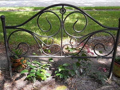 My Crazy Quilt Life: From Metal Headboard to Garden Trellis-- I love this idea! Could ask grandma to keep an eye out for broken or incomplete bed frames. Would be able to string my lanterns through this! Metal Bed Frame Garden Ideas, Old Metal Headboard Ideas Reuse, Bed Frame In Garden, Headboard In Garden Ideas, Metal Headboard Garden Ideas, Iron Headboard Garden Ideas, Bed Frame Garden Ideas, Headboard Garden Ideas, Iron Headboard Ideas